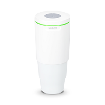 Eine weiße Dosieranlage mit grünem Leuchtring und dem Logo "grünbeck" oben.